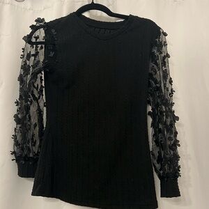 Black knit long sleeve with appliqué sleeves. Great condition